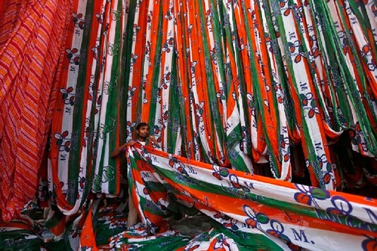 For representation: A worker pulls out a roll of cloth to be made into flags for the Trinamool Congress (TMC) party. (Image: Reuters)