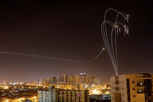 Iron Dome anti-missile system fires interception missiles as rockets are launched from Gaza towards Israel as seen from the city of Ashkelon, Israel. (Image: Reuters) Iron Dome anti-missile system fires interception missiles as rockets are launched from Gaza towards Israel as seen from the city of Ashkelon, Israel. (Image: Reuters)