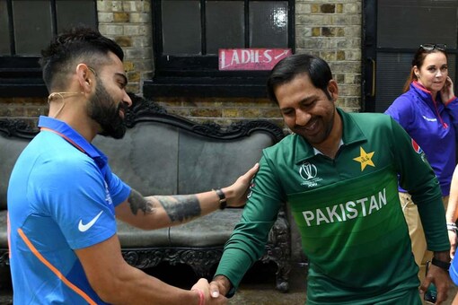 Virat Kohli with Sarfaraz Ahmad ahead of the clash.