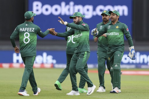 Pakistan celebrate taking a wicket. (AP) 