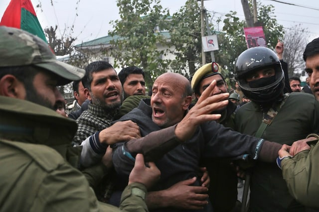 File photo of former Jammu and Kashmir lawmaker Engineer Abdul Rasheed, center, detained by police during a protest.(Image: PTI)