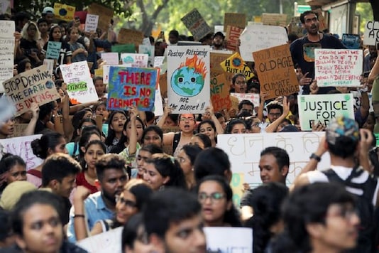 Students and activists hold placards with messages as they participate in a Global Climate Strike rally in New Delhi, India (Reuters) Students and activists hold placards with messages as they participate in a Global Climate Strike rally in New Delhi, India (Reuters)