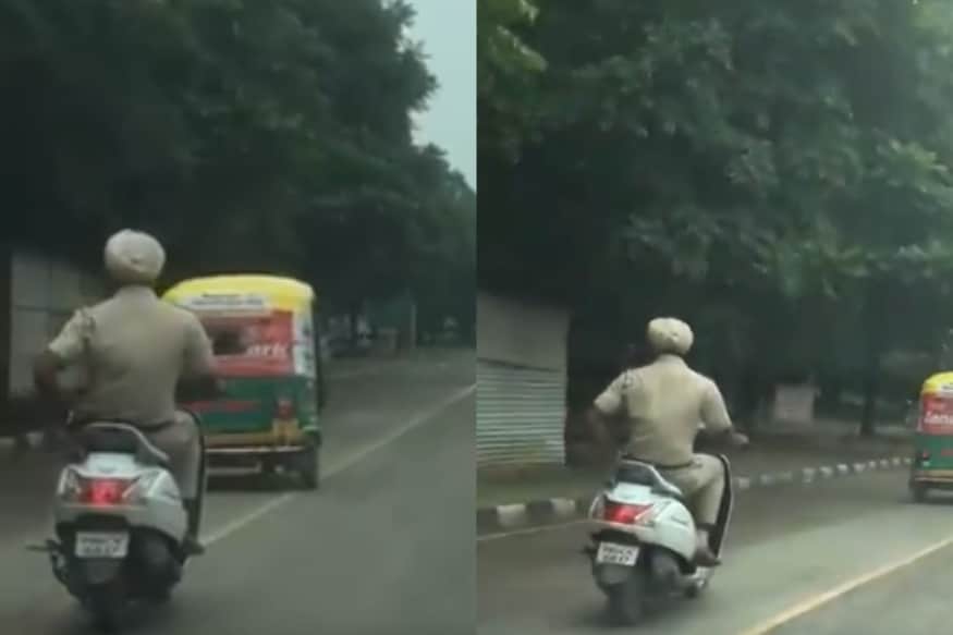 Image result for Punjab police driving scooter without helmet and talking in mobile