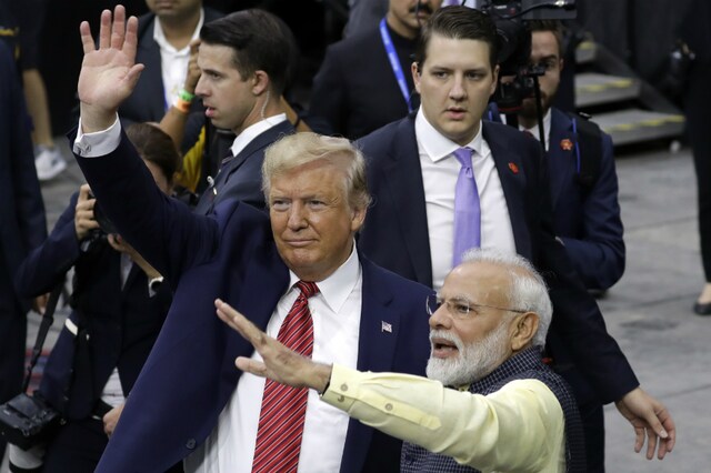 US President Donald Trump and Prime Minister Narendra Modi walk around NRG Stadium waving to the crowd during the ‘Howdy, Modi’ event, on September 22 in Houston. (AP Photo: Evan Vucci)