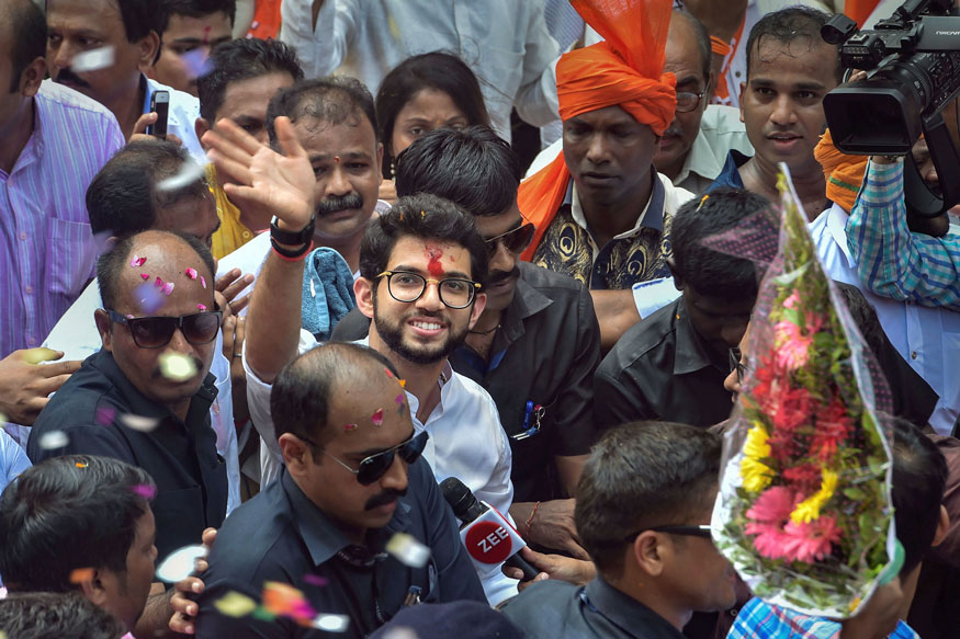 Yuva Sena President Aditya Thackeray waves as he arrives to file his nominations papers from Worli seat for upcoming Maharashtra Assembly elections, in Mumbai. (Image: PTI)