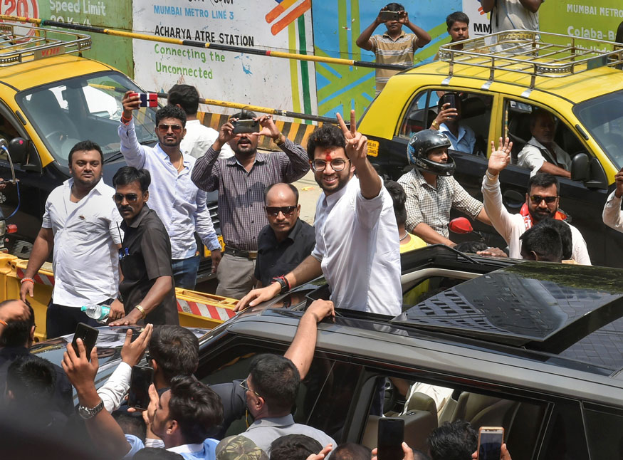 Yuva Sena President Aditya Thackeray waves as he arrives to file his nominations papers from Worli seat for upcoming Maharashtra Assembly elections, in Mumbai. (Image: PTI)