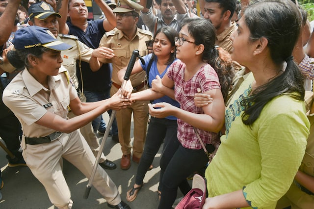 Protesters clashing with the  police in Mumbai's Aarey colony. 