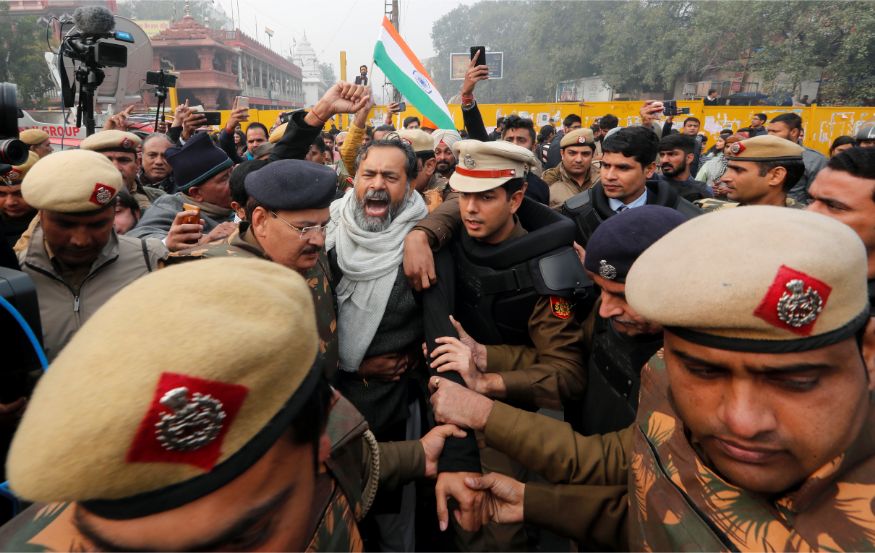 Police officers detain a demonstrator during a protest against a new citizenship law at Red Fort in Delhi. (Image: Reuters)