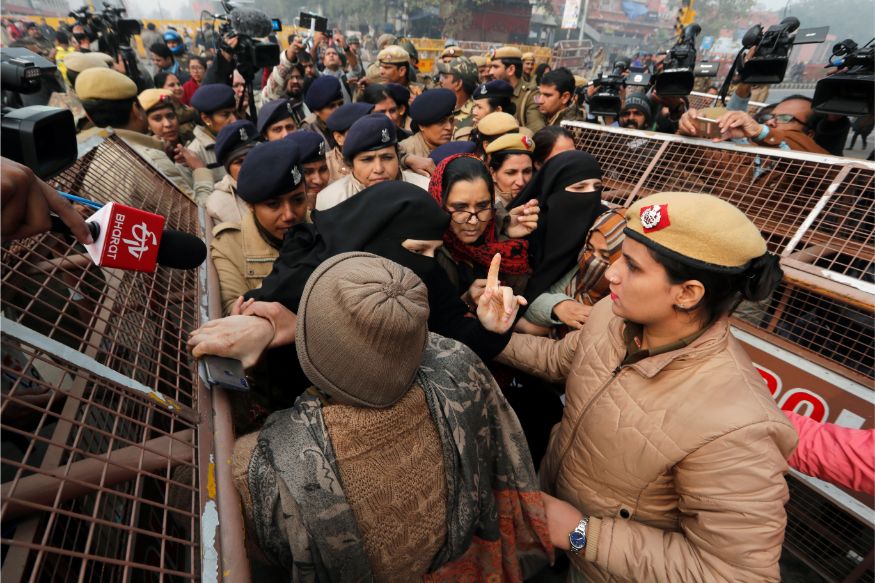 Police officers detain demonstrators during a protest against a new citizenship law at Red Fort in Delhi. (Image: Reuters)