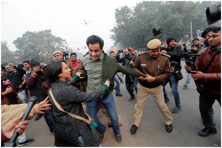 Police officers detain demonstrators during a protest against a new citizenship law at Red Fort in Delhi. (Image: Reuters)