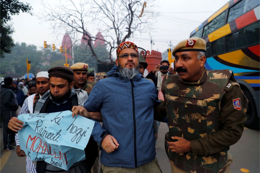 Demonstrators are detained during a protest against a new citizenship law, in Delhi. (Image: Reuters)