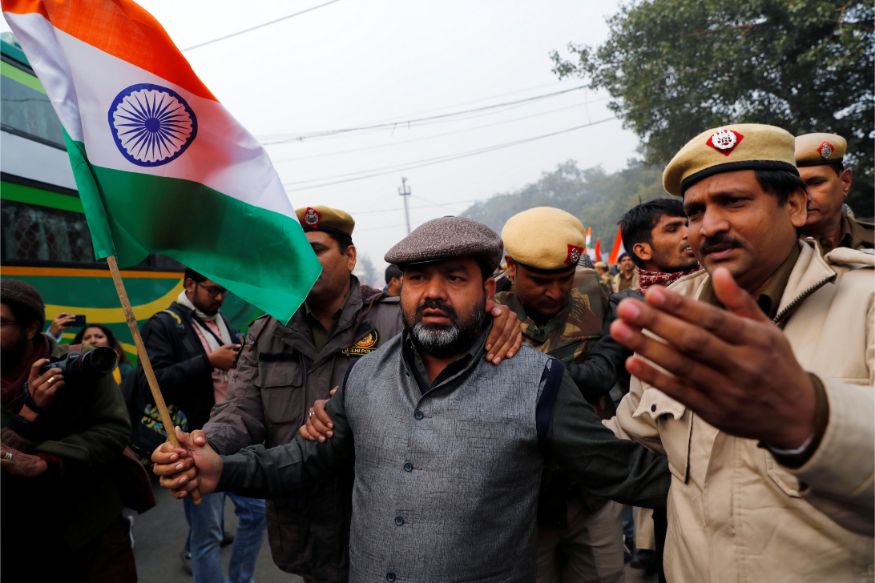 Police officers detain a demonstrator during a protest against a new citizenship law at Red Fort in Delhi. (Image: Reuters)