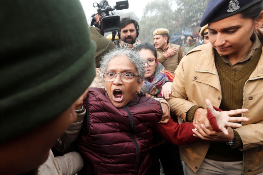 Police officers detain a demonstrator during a protest against a new citizenship law at Red Fort in Delhi. (Image: Reuters)
