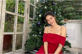 Ananya Panday Soaks in Christmas Spirit in Red Off-shoulder Dress