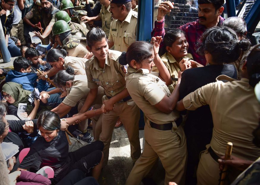 Protestors detained by police for defying prohibitory orders imposed in the area during an anti-Citizenship Act protest rally, in Bengaluru. (Image: PTI)