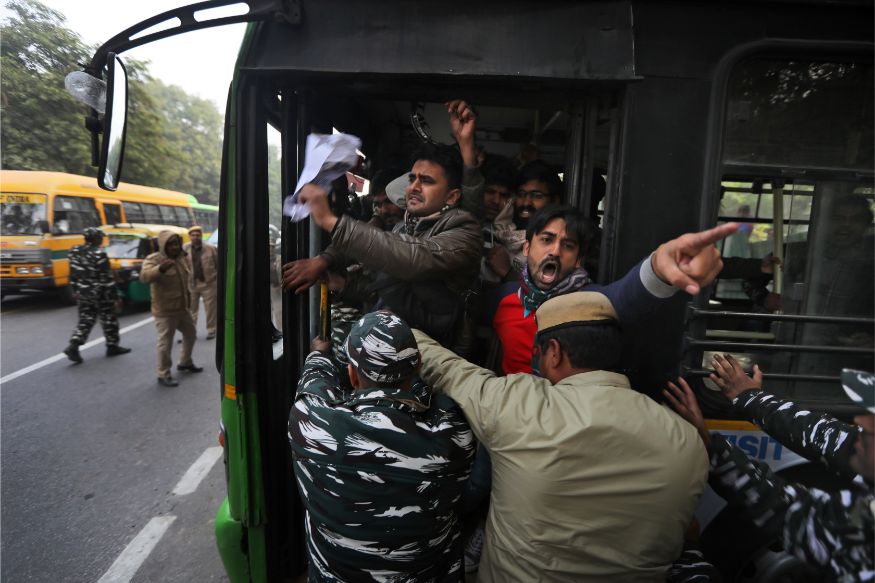 Policemen detain students protesting outside Uttar Pradesh Bhawan against a new citizenship law and violence by police in the state, in New Delhi. (Image: AP)