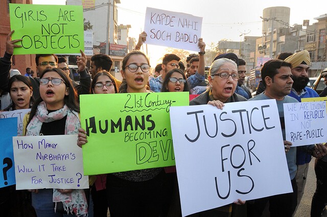Students and members of Voice of Amritsar hold placards during a protest demanding justice for the rape and murder of a 25-year-old veterinarian, in Hyderabad. (Image: PTI)