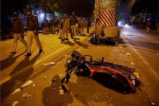 File photo of damaged vehicles strewn near Jamia Millia Islamia following violence that erupted against Citizenship Amendment Act, in New Delhi. (Image: PTI)