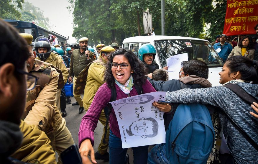 Protestors detained by police for defying prohibitory orders imposed by the Delhi Police in the area during an anti-Citizenship Act protest, at Red Fort, in New Delhi. (Image: PTI)