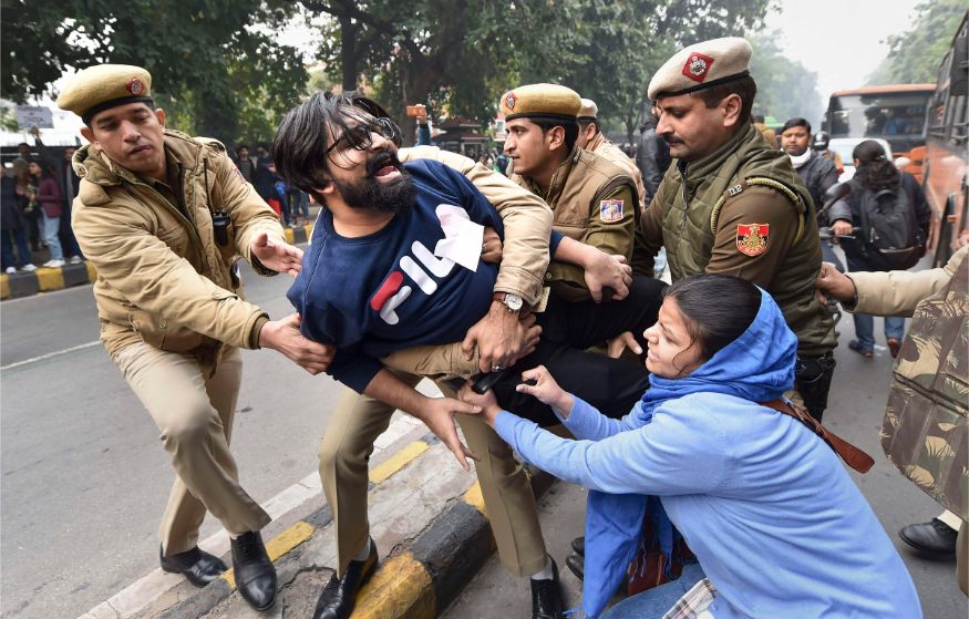 Protestors detained by police for defying prohibitory orders imposed by the Delhi Police in the area during an anti-Citizenship Act protest, at Red Fort, in New Delhi. (Image: PTI)