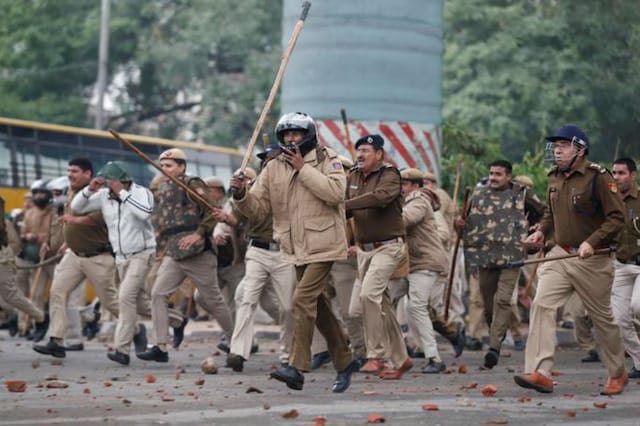 Students clash with police at Jamia (Credits: Reuters)