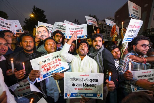 Indian Youth Congress (IYC) activists raise slogans during a candlelight march demanding justice for rape victims, at UP Bhawan in New Delhi, Saturday, Dec. 7, 2019. (PTI Photo) Indian Youth Congress (IYC) activists raise slogans during a candlelight march demanding justice for rape victims, at UP Bhawan in New Delhi, Saturday, Dec. 7, 2019. (PTI Photo)
