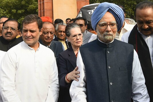File photo of Congress interim president with party leaders Manmohan Singh and Rahul Gandhi.