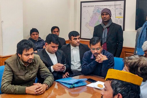 Delhi CM Arvind Kejriwal waits to file his nomination for the forthcoming State Assembly polls. (Image: PTI)