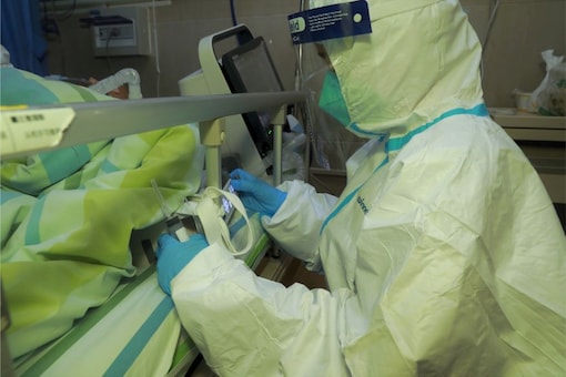 For representation: A medical staff attends a patient with pneumonia caused by the new coronavirus at the Zhongnan Hospital of Wuhan University. Reuters