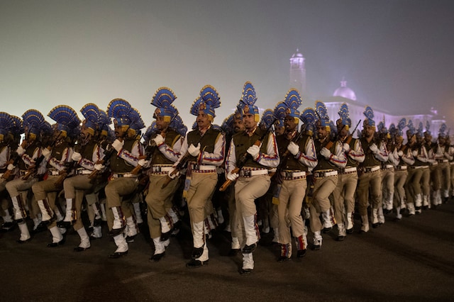 Soldiers take part in the rehearsal for the Republic Day parade early morning in New Delhi. (Image: Reuters)
