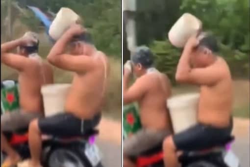 Two Men Arrested for Viral Video Which Shows Them Taking a Bath While Riding on a Bike