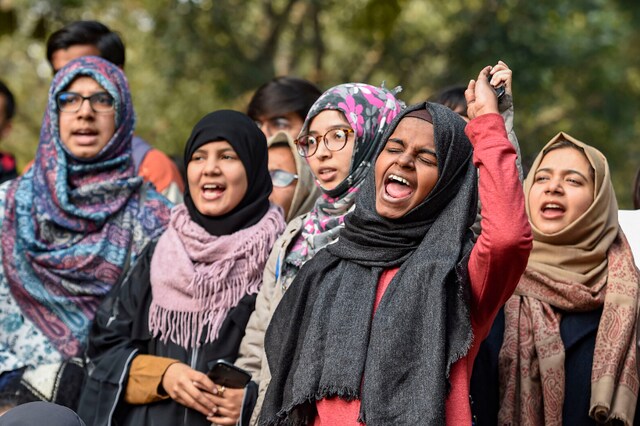 Women shout slogans during  their demonstration Azad Women for Azadi against Citizenship (Amendment) Act and NRC, at Jantar Mantar in New Delhi on Tuesday.