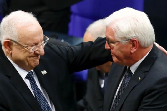 Israeli President Reuven Rivlin and German President Frank-Walter Steinmeier embrace during the commemoration service of victims of the Nazi dictatorship at Germany's lower house of parliament, Bundestag, in Berlin, Germany Israeli President Reuven Rivlin and German President Frank-Walter Steinmeier embrace during the commemoration service of victims of the Nazi dictatorship at Germany's lower house of parliament, Bundestag, in Berlin, Germany
