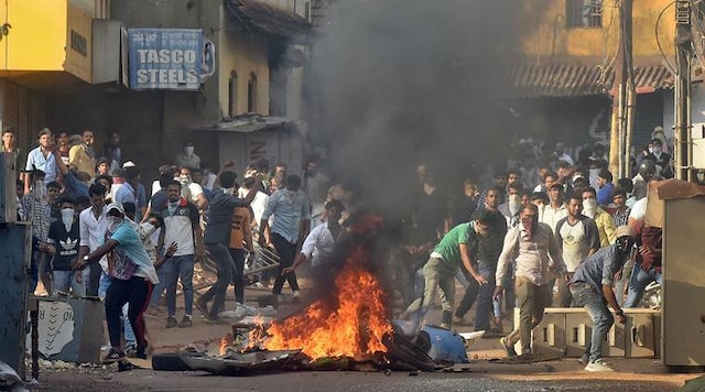 Demonstrators throw stones towards police during a protest against a new citizenship law, in Mangaluru, India, December 19, 2019. (Reuters)