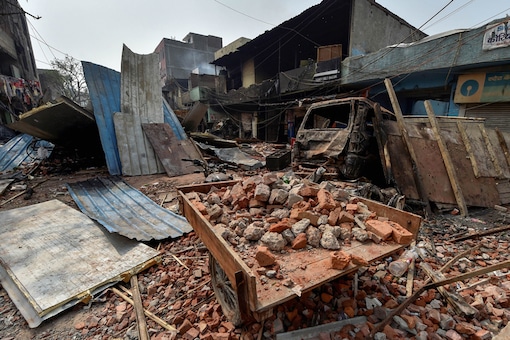 Brick-bats are seen amid vandalised properties in Bhagirathi Vihar area of the riot-affected north east Delhi. (Image: PTI)
