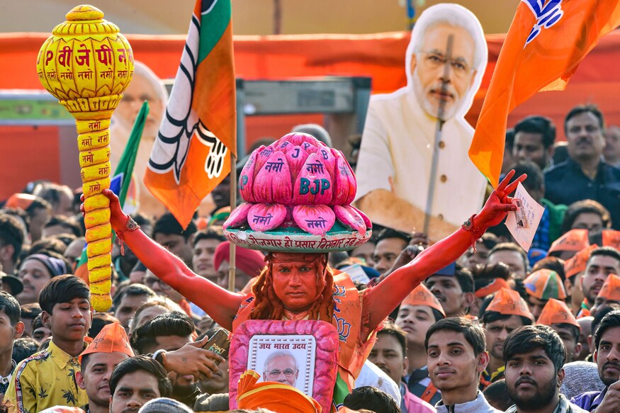 PICS: PM Modi Addresses Mega Rally in Karkardooma - News18