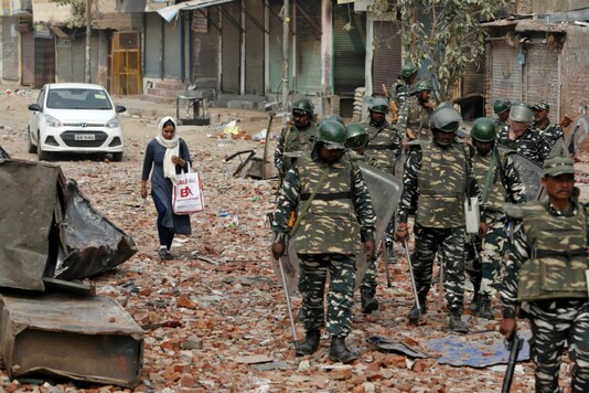 File photo of security forces patrolling a street in New Delhi after the riots in February. (Reuters)