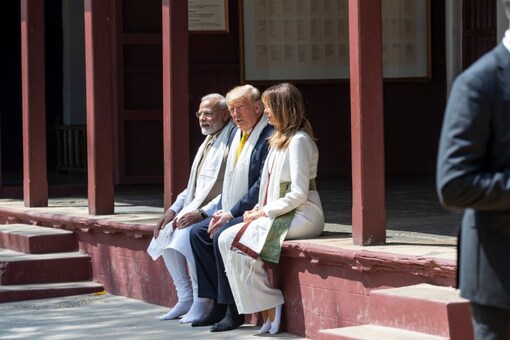 US President Donald Trump and first lady Melania Trump with Prime Minister Narendra Modi pose for photographers during their visit to Gandhi Ashram in Ahmedabad. (Image: AP)