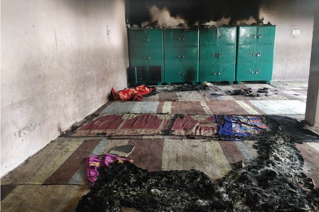 Charred remains of blankets and floor mats inside a room. (Photo: Eram Agha)