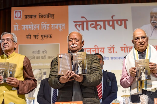 RSS chief Mohan Bhagwat (C) during an event to release a book, 'Gandhi Ko Samajhney Ka Yahi Samay' in New Delhi on Monday. (PTI)