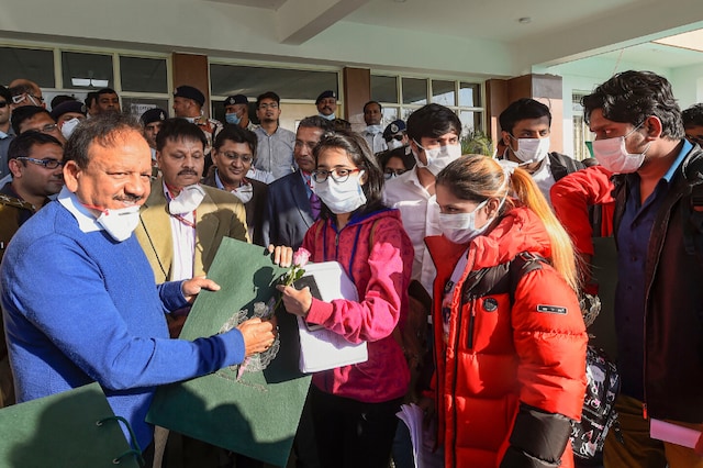 Union Minister of Health and Family Welfare Harsh Vardhan interacts with Indians who were air-lifted from Wuhan following out-break of the deadly novel cornavirus, before their release from the ITBP quarantine facility, at Chhawla, in New Delhi, Monday, Feb 17,2020. (PTI Photo/Kamal Singh)