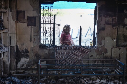 Image for representation. A woman looks at a mosque damaged during the recent communal riot in Delhi, at Old Mustafabad area in Northeast Delhi, Saturday, February 29, 2020. (PTI Photo)