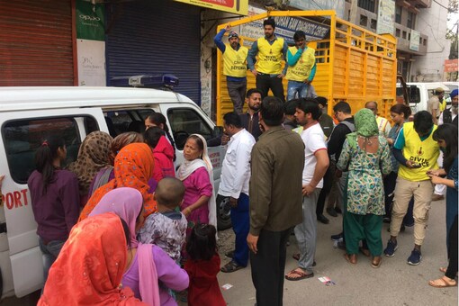 People line up at an ambulance in Brahmpuri on Thursday. 