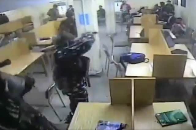 Screengrab of video showing Delhi Police personnel barging in the library of Jamia Millia Islamia and beating the students on December 15, 2019.  