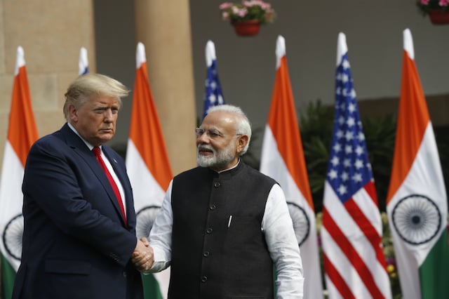 US President Donald Trump and Prime Minister Narendra Modi shake hands before their meeting at Hyderabad House in New Delhi on February 
 25, 2020. (AP Photo)

