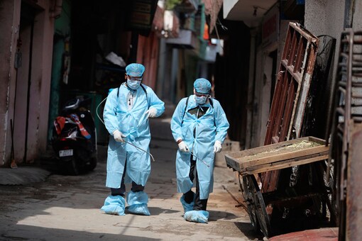For representation: Health workers spray disinfectants as a precautionary measure against COVID-19 in a residential area in Jammu. (Image: AP)