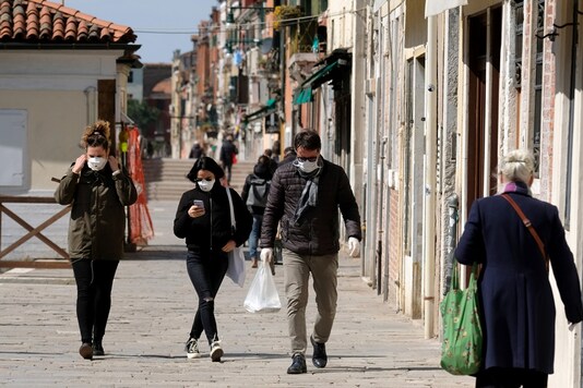 Citizens wearing protective masks in the streets of Venice during the current emergency of the coronavirus disease (COVID-19) in Venice, Italy, March 25, 2020. (Image: REUTERS)