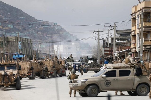 Afghan security forces inspect near the site of an attack in Kabul, Afghanistan. (Reuters)