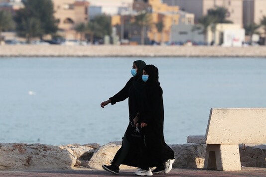 Women wear protective face masks, as they walk, after Saudi Arabia imposed a temporary lockdown on the province of Qatif, following the spread of coronavirus, in Qatif, Saudi Arabia March 10, 2020. (Image: Reuters)