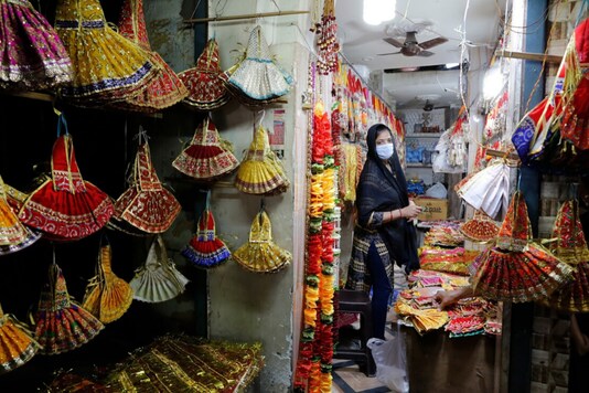 (Image for representation) A woman wearing a mask at a shop. (Reuters)